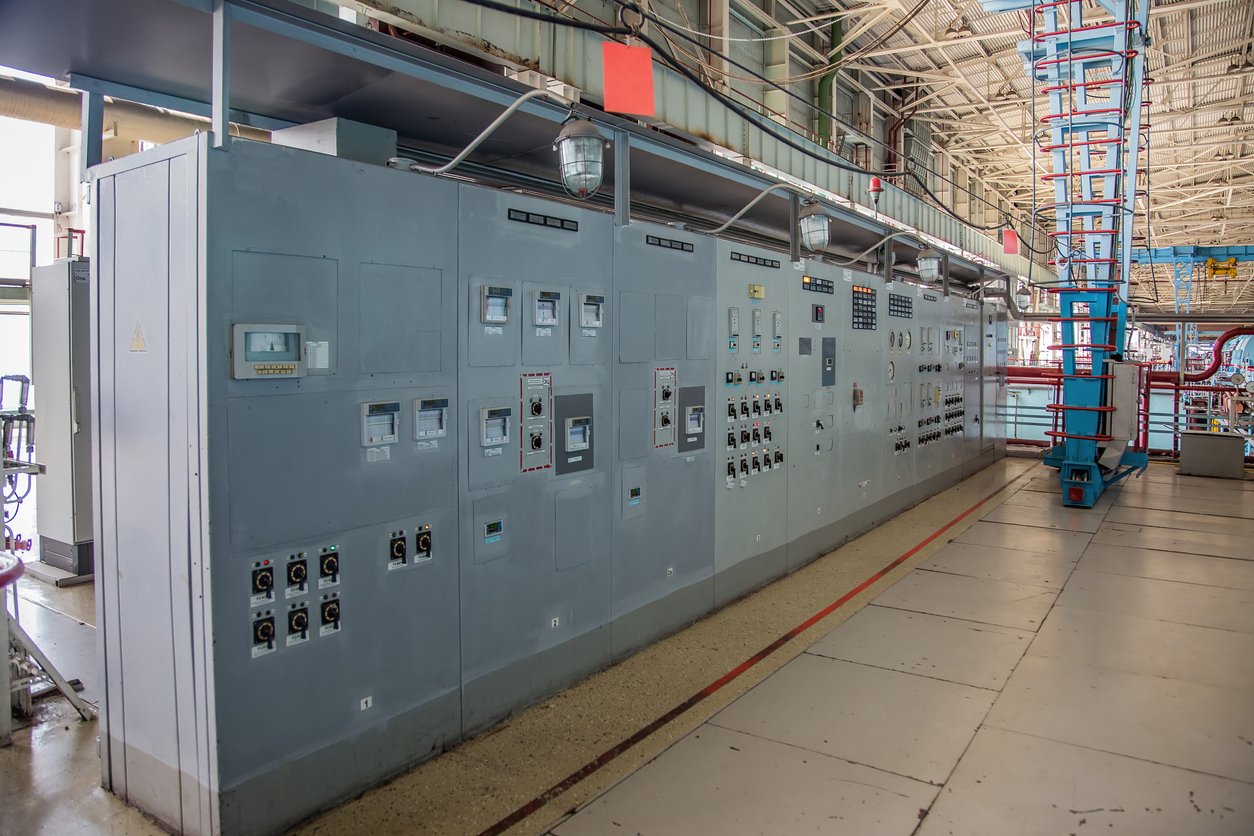 Motor control center panels in industrial facility with electrical cabinets and control systems