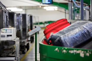 Airport baggage handling system used to illustrate vibration condition monitoring for conveyors, sorter drives, and terminal infrastructure.