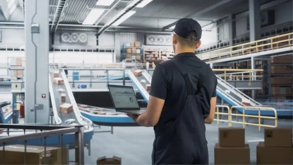 iStock-2204712787- Laptop Computer in Distrubution Center, Monitoring the Conveyors-v2