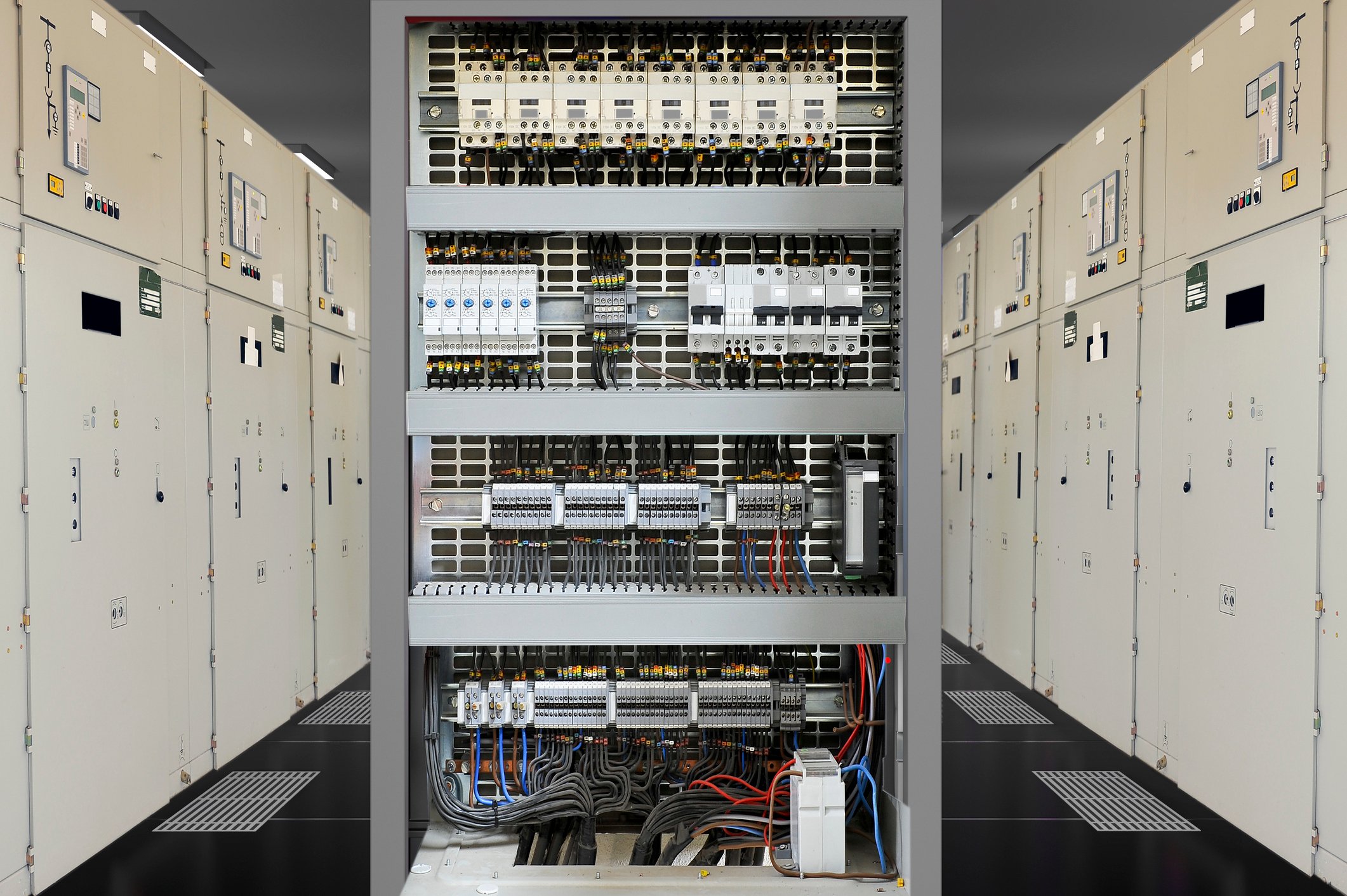 Interior view of an industrial motor control center (MCC) cabinet showing bus bars, breaker terminals, and electrical distribution components