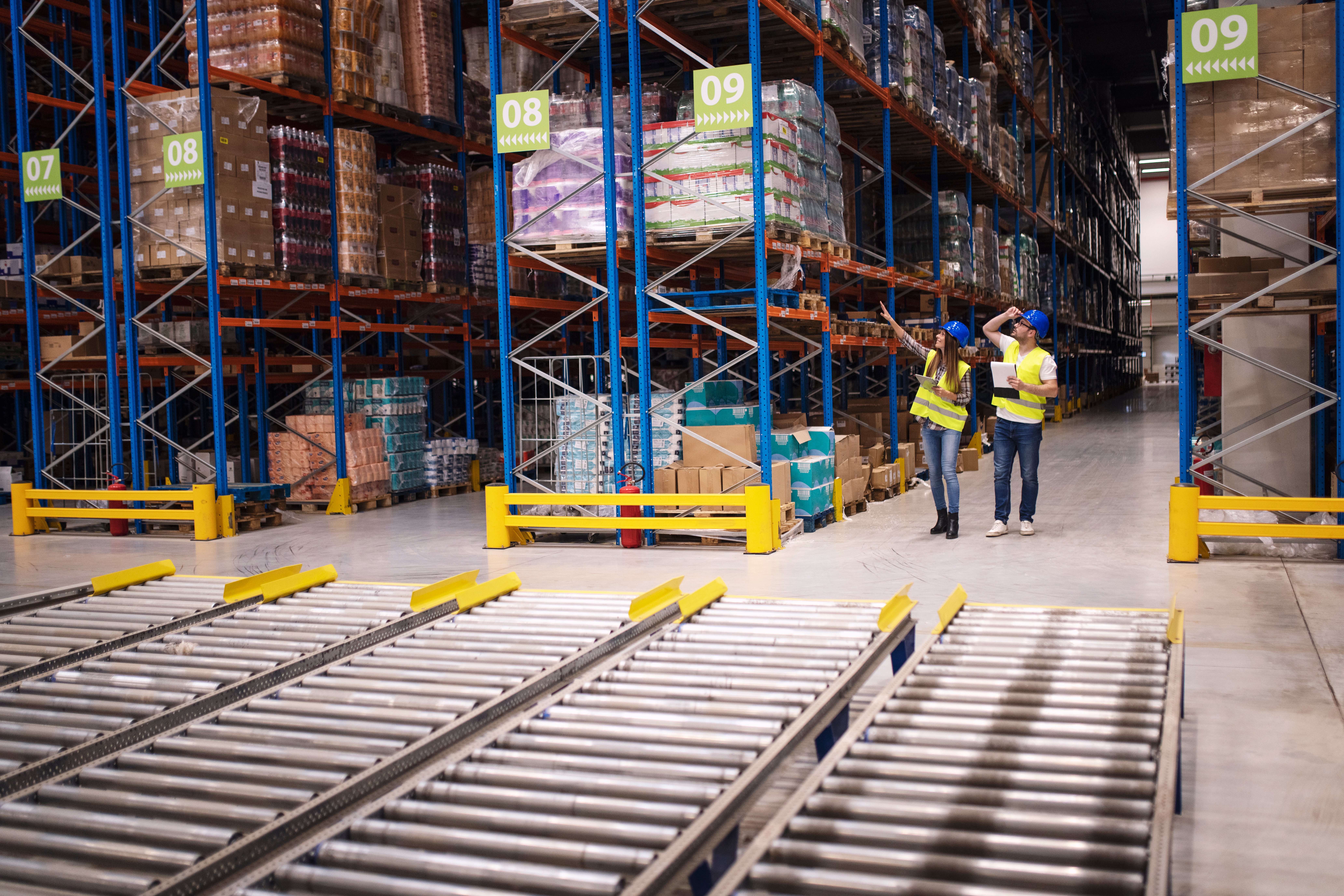 warehouse-workers-checking-inventory-goods-distribution-large-storehouse-1