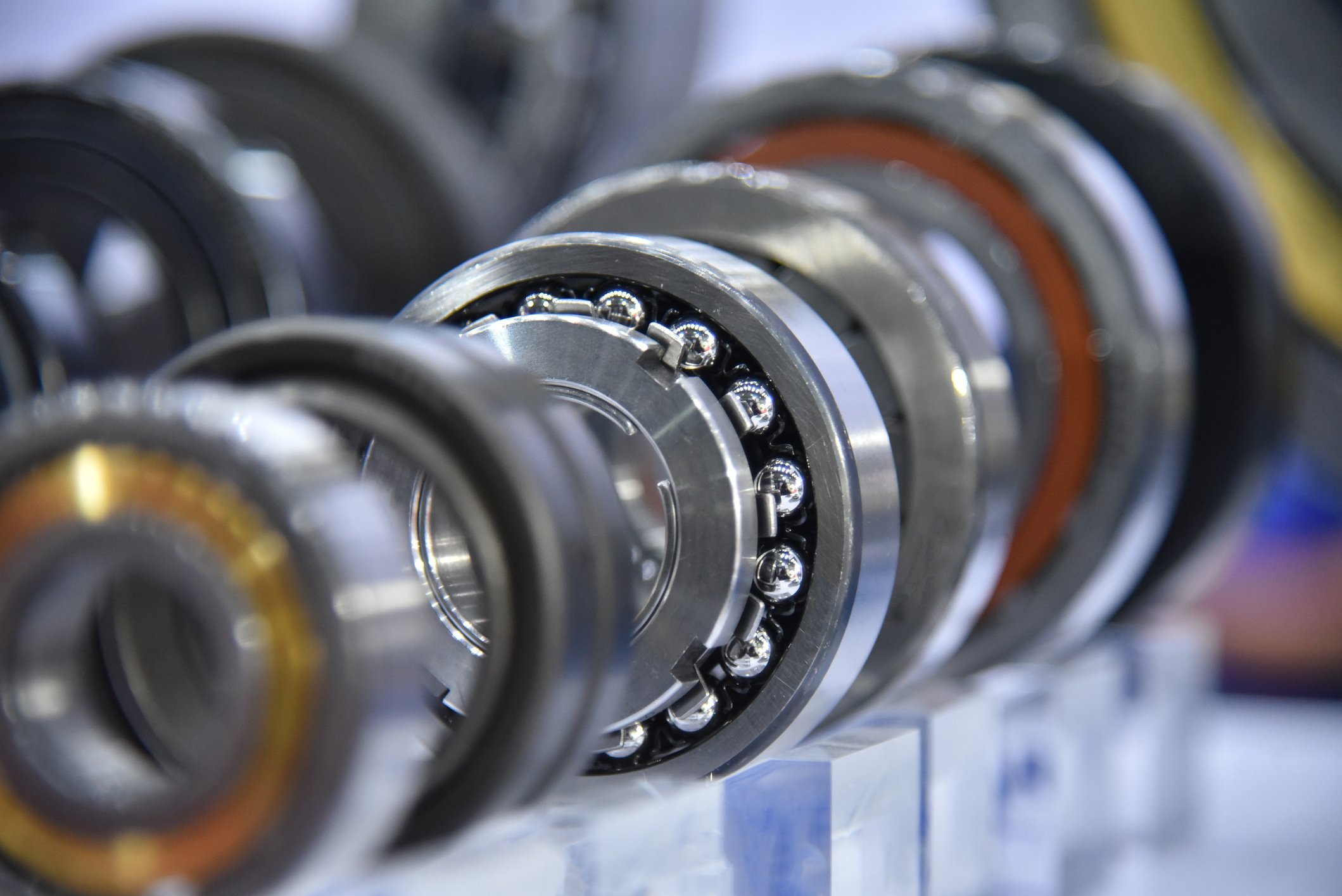 Close-up of an industrial conveyor system bearing assembly showing exposed ball bearings, rollers, and rotating mechanical components associated with early-stage bearing wear and conveyor failure detection. 
